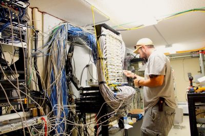 installation tech works on cables and routers