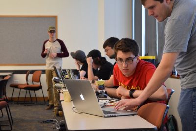 high school students work on a cybersecurity problem