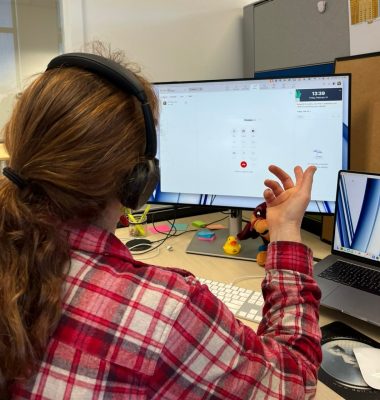 person using Zoom phone at a desk