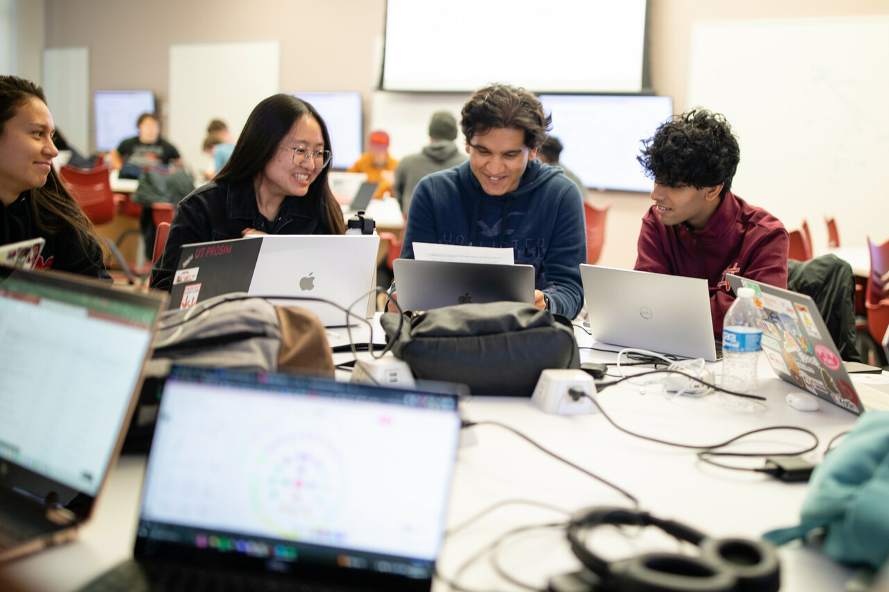 Students using laptops in class