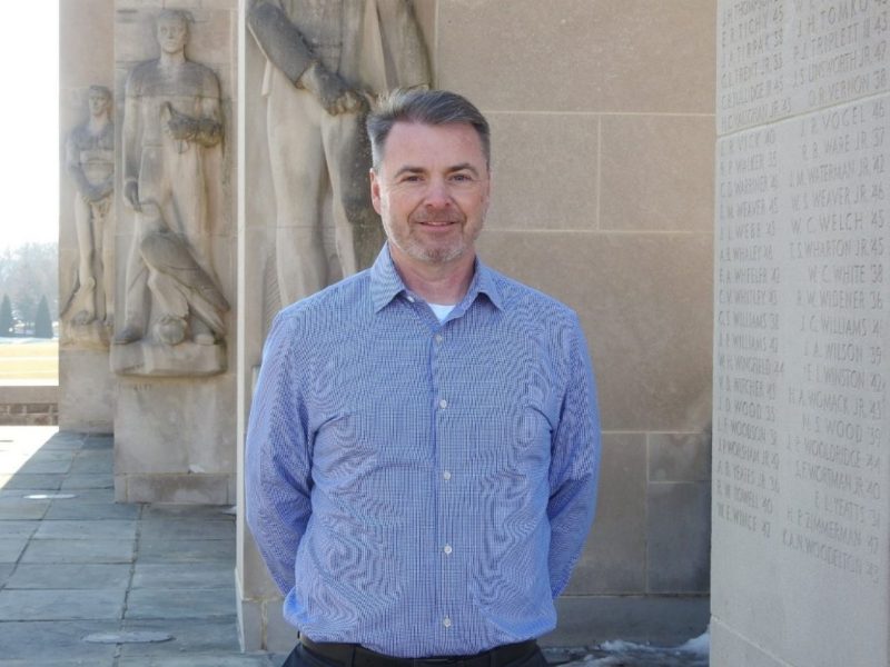 Steven Lee, executive director for Network Infrastructure and Services at Virginia Tech, standing outdoors near the Pylons on campus.