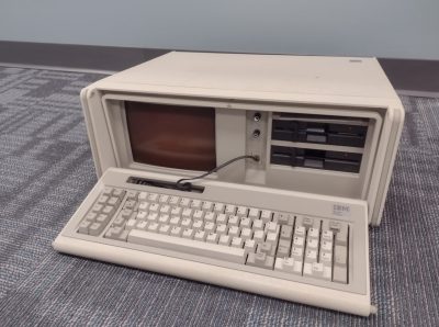 This IBM Personal Portable Computer, more affectionately known as a "luggable," was a required piece of equipment for engineering students in the mid 1980s. It weighs approximately 30 lbs., and held 256 KB of memory. 