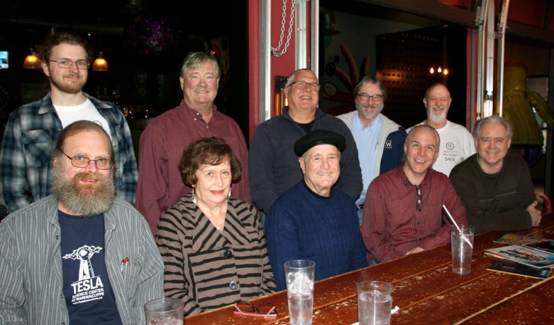 Nine colleagues who have worked on IPv6 at Virginia Tech smile in group photo.
