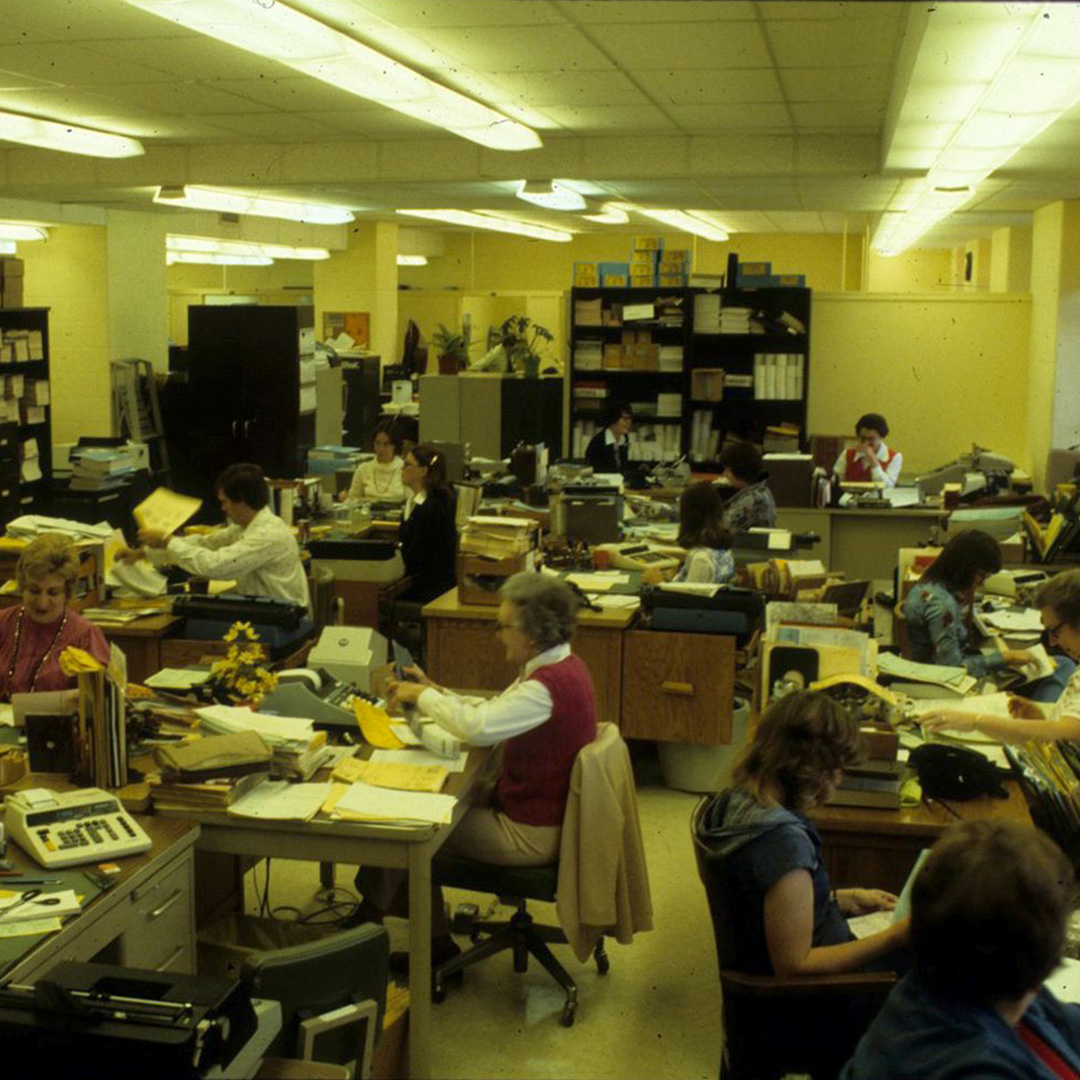 Typing pools like this one, ca. 1970s, predated mainframe terminals for managing records and data.